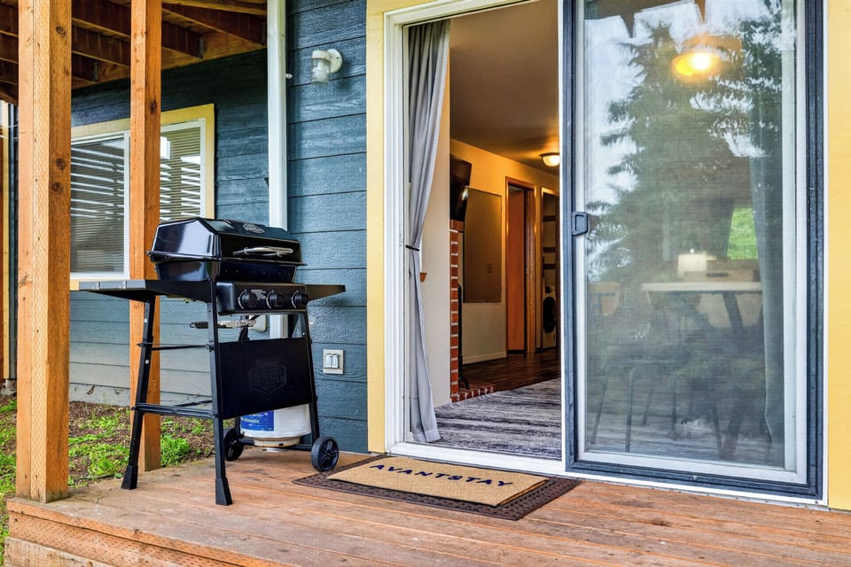 Private patio entry with a gas grill for easy outdoor meals.