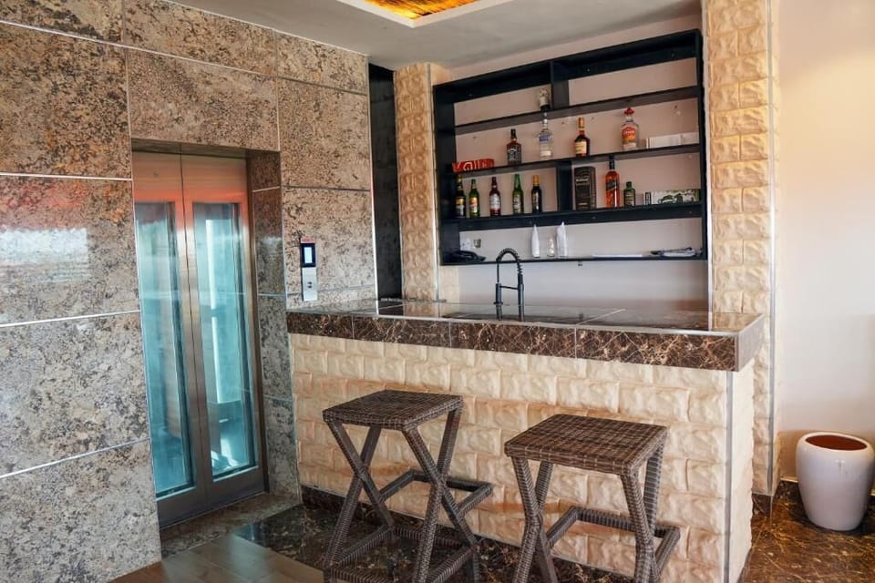 Deluxe Apartment, Balcony, City View | Bar (on property)