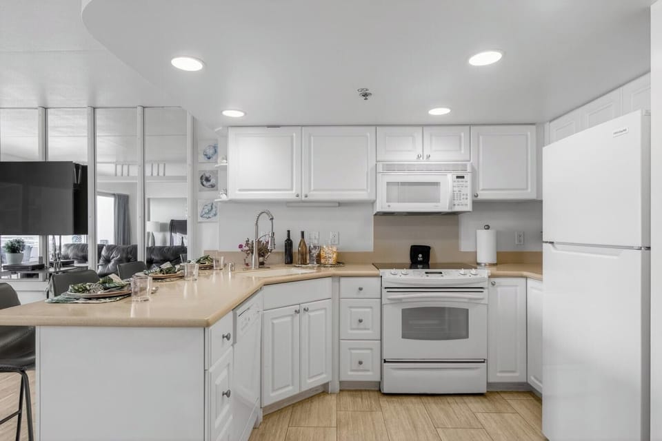 The kitchen features full size appliances and spacious counter space for easy cooking.