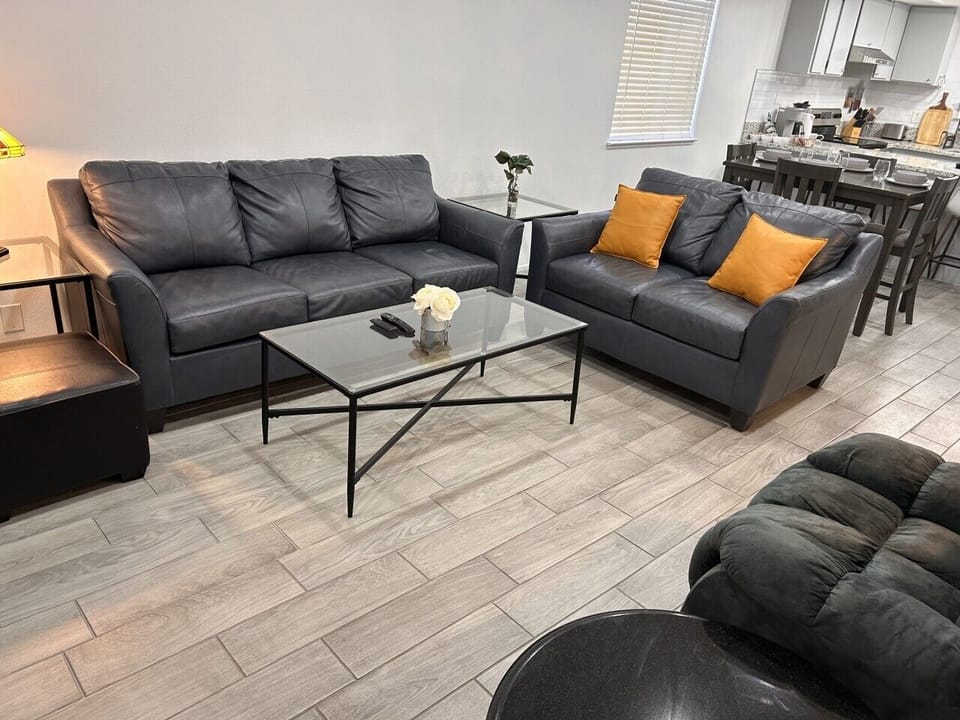 Spacious living room with TV