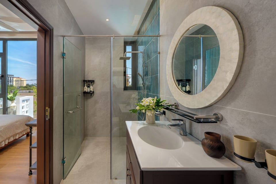 Designer toiletries, hair dryer, slippers, bidet