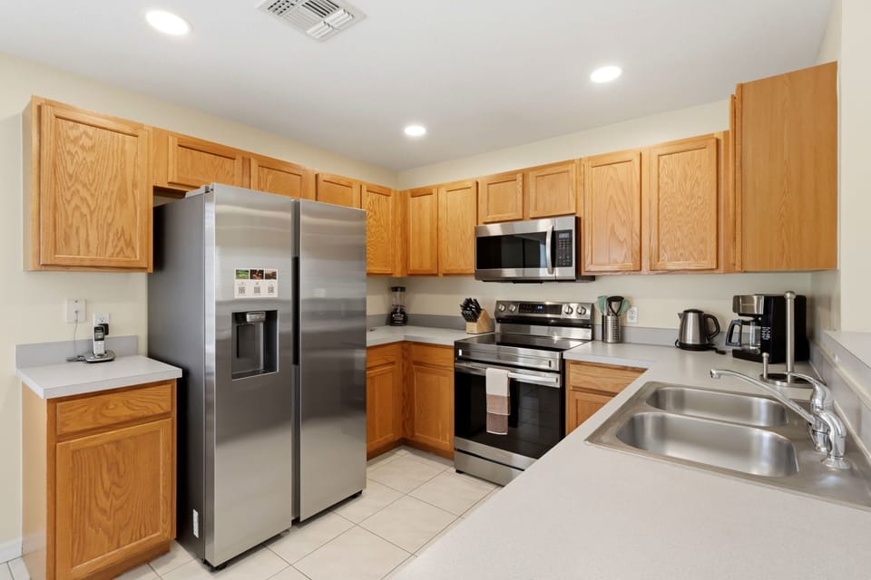 Prepare meals with ease in the fully equipped kitchen.
