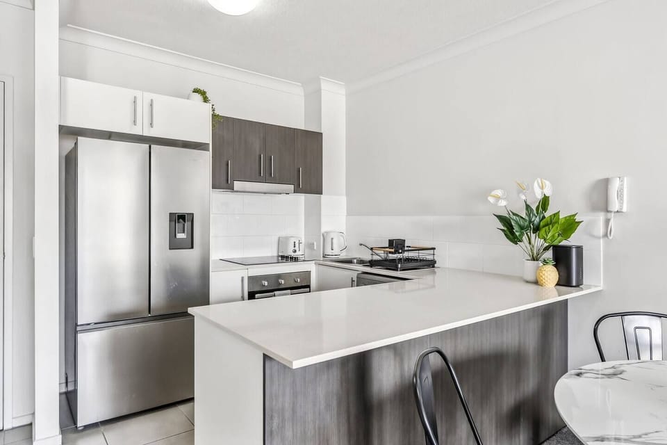 Prepare everything from a quick breakfast to a home-cooked dinner in the kitchen, where sleek finishes and generous bench space make everyday dining feel effortless.