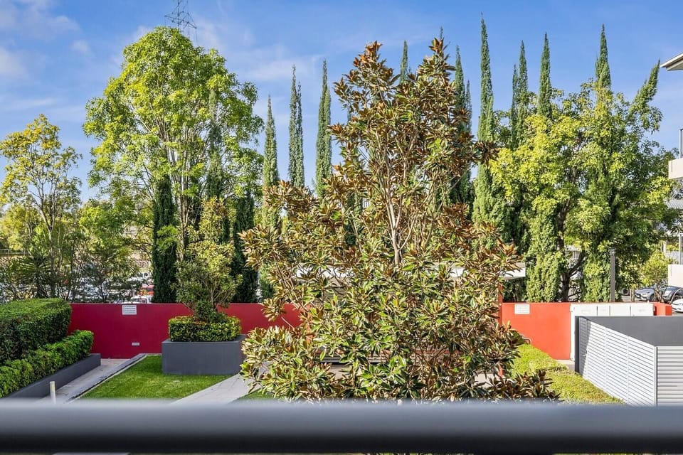 Take in the greenery from the balcony views, where landscaped gardens and mature trees bring a welcome sense of calm to this well-connected location.