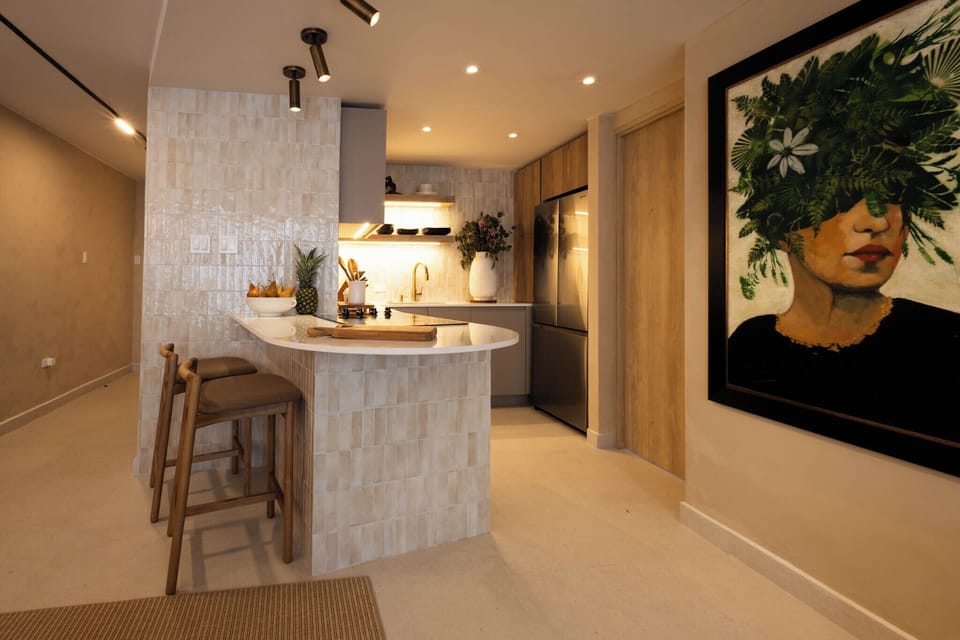 Modern designer kitchen with breakfast bar and warm lighting