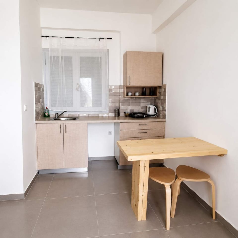 Athena: Bright interior with kitchenette and patio access