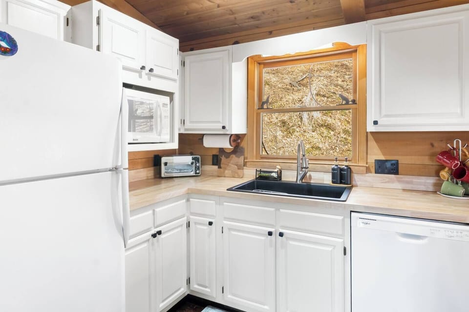 Spacious kitchen designed for convenience and comfort, featuring quality cookware, generous storage, and an inviting layout ideal for cooking, dining, and gathering with friends and family.