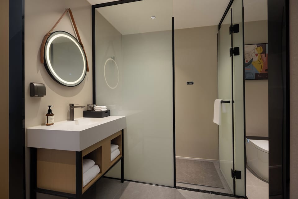 Luxury Twin Room, City View | Bathroom | Shower, hair dryer, towels, soap