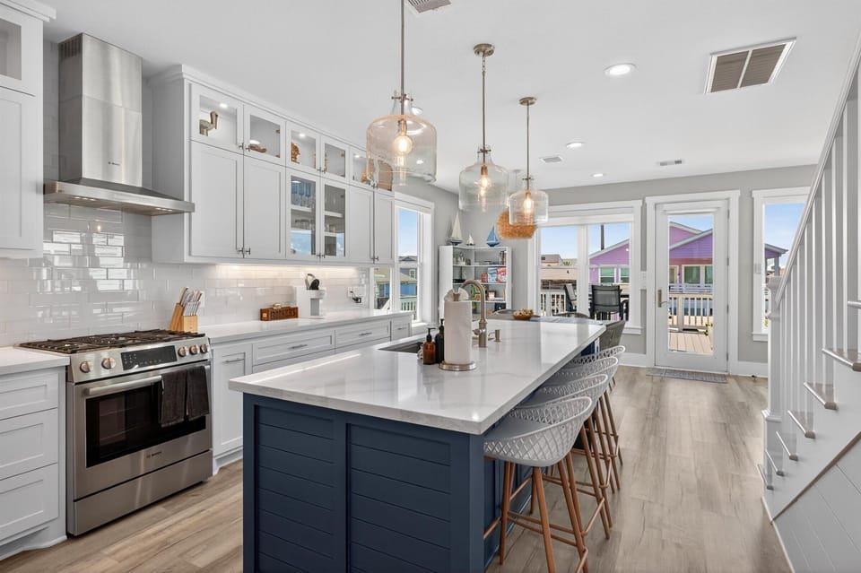 Beautiful kitchen with island and gleaming countertops.