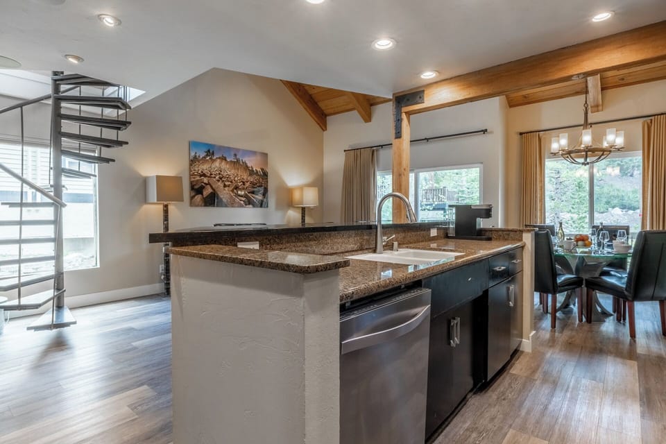 Your fully equipped kitchen features granite countertops, stainless steel appliances, and an open layout that flows into the dining and living spaces—perfect for gathering and creating memories.