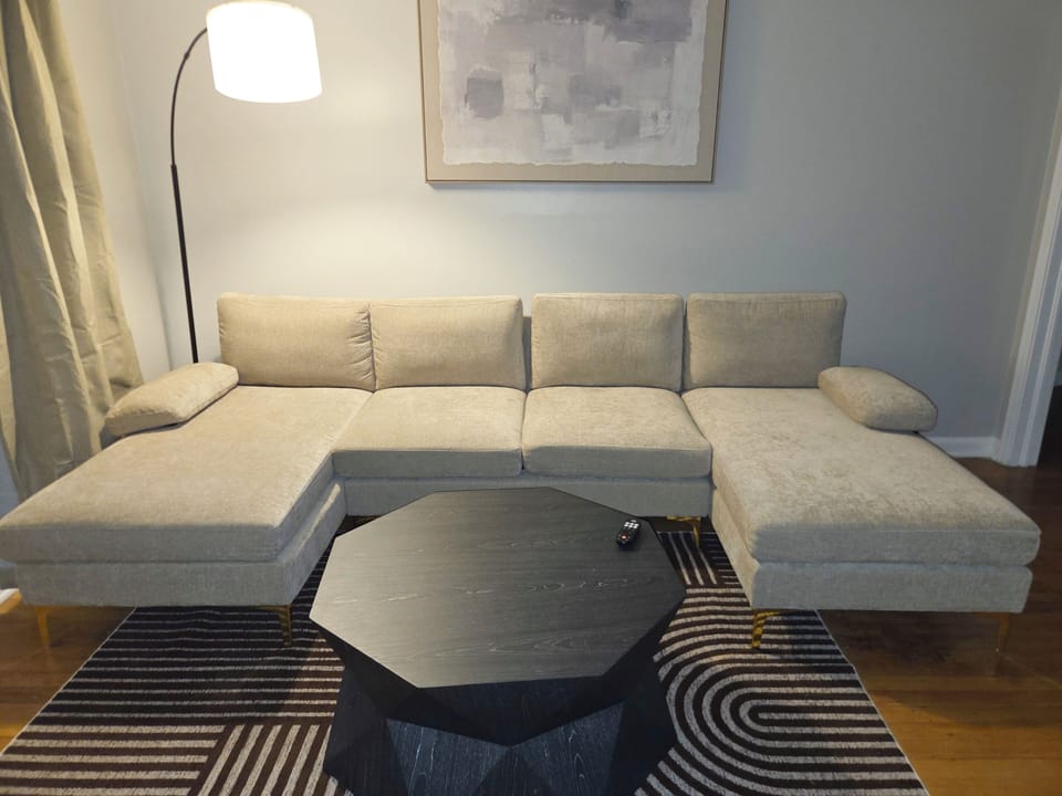 Stylish lounge with oversized sectional and modern designer touches