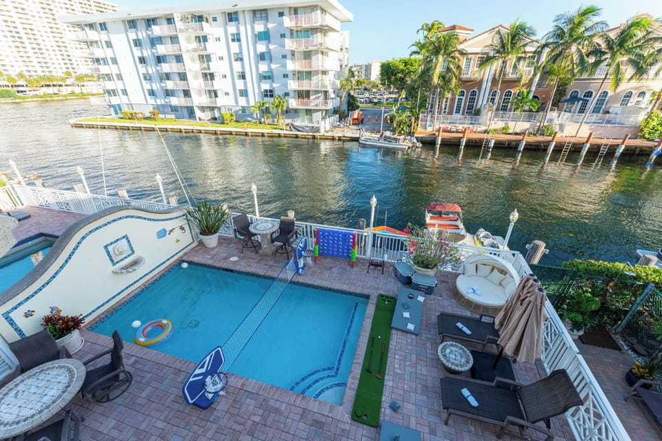 Private pool and waterfront patio create the perfect outdoor escape.