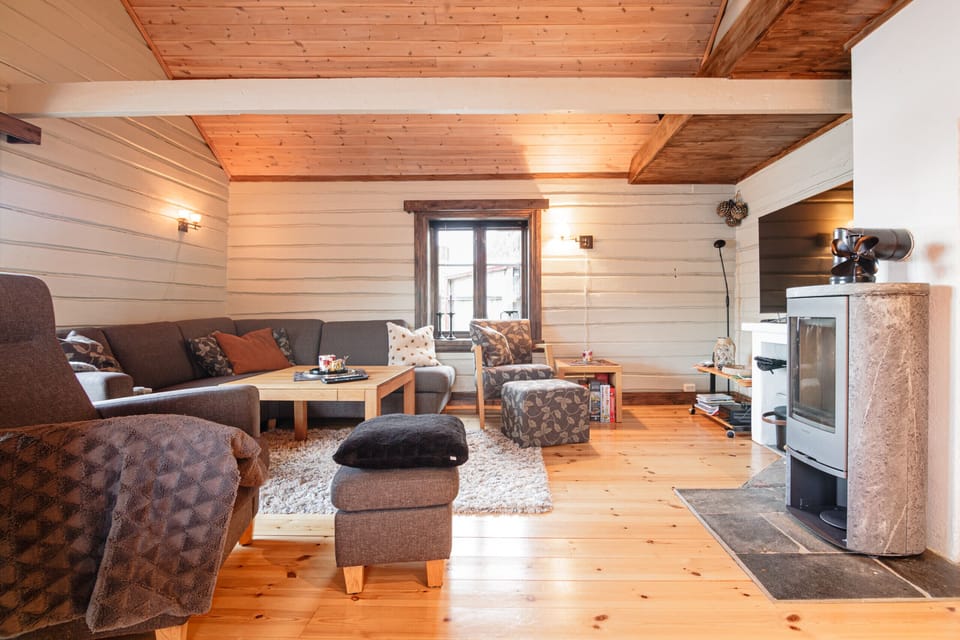 The living area has plenty of seating space, TV and a fireplace!