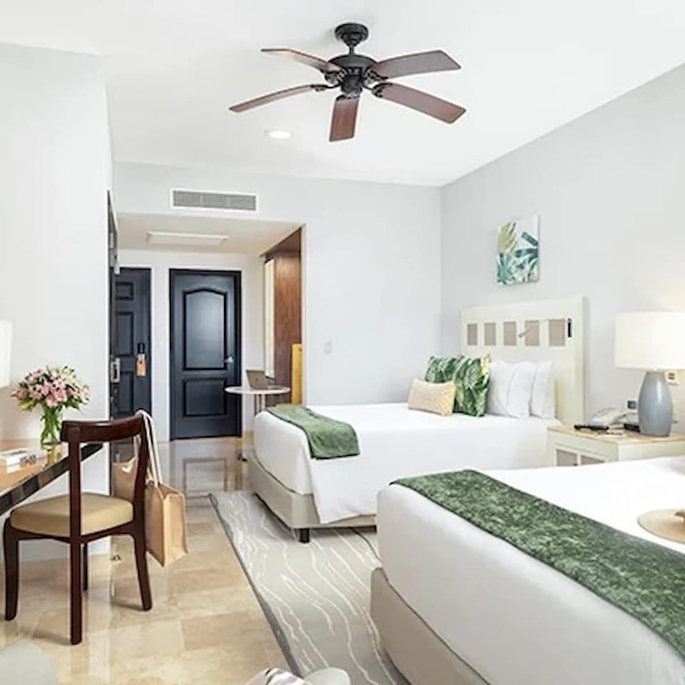 Spacious second bedroom with two queen beds—perfect for family or friends.