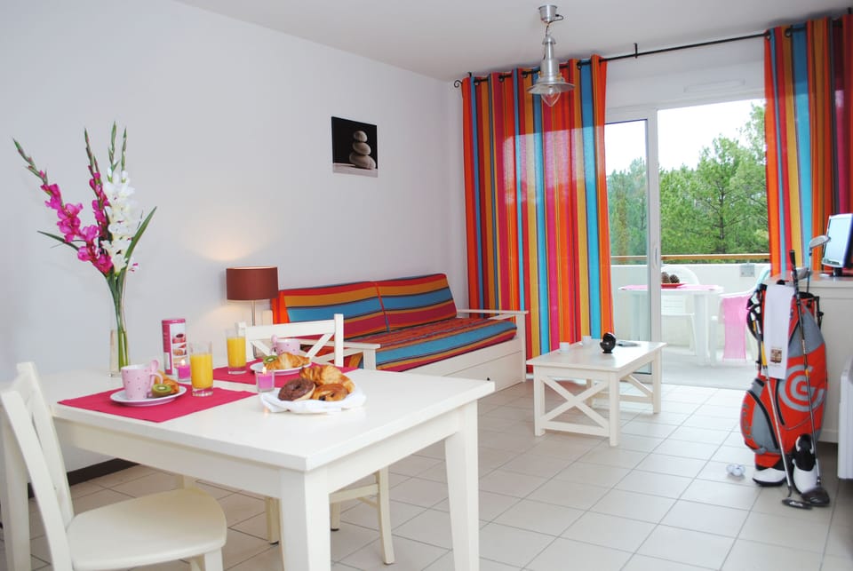 The bright, open living and dining space is cheerfully decorated and designed for easy family living, just 600 metres from the Atlantic beach.