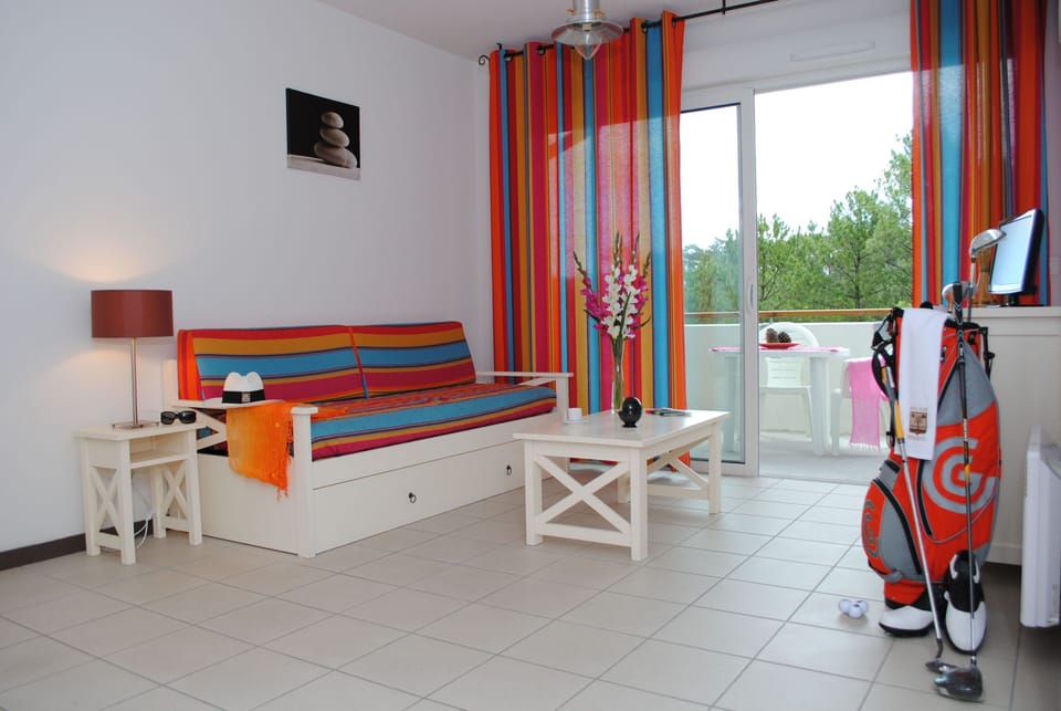 The colourful living area provides a welcoming space to relax after a day on the Atlantic surf beach, just 600 metres from the residence.