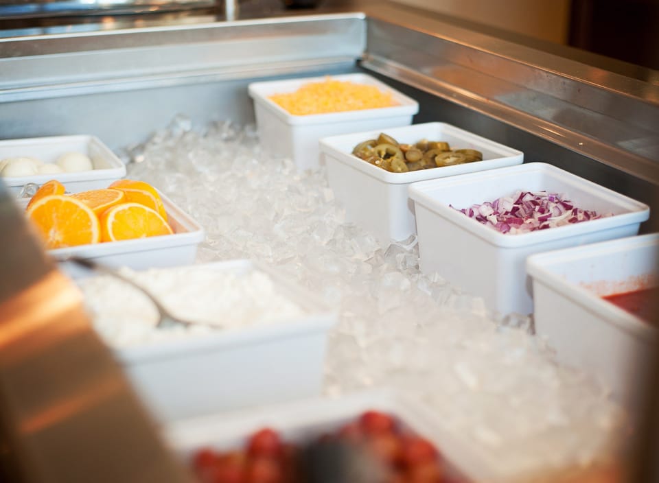 Fresh ingredients on display at the breakfast buffet — part of the complimentary daily spread