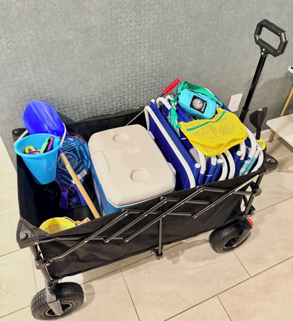 Beach-ready wagon stocked with chairs, cooler, and family-friendly gear