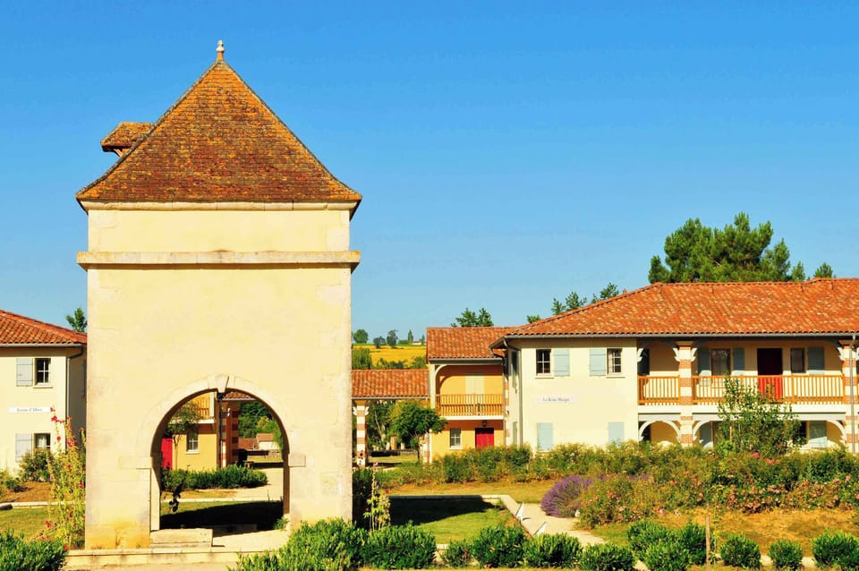 The historic towers of Nérac rise above the rooftops — the town centre is just 150 metres away.