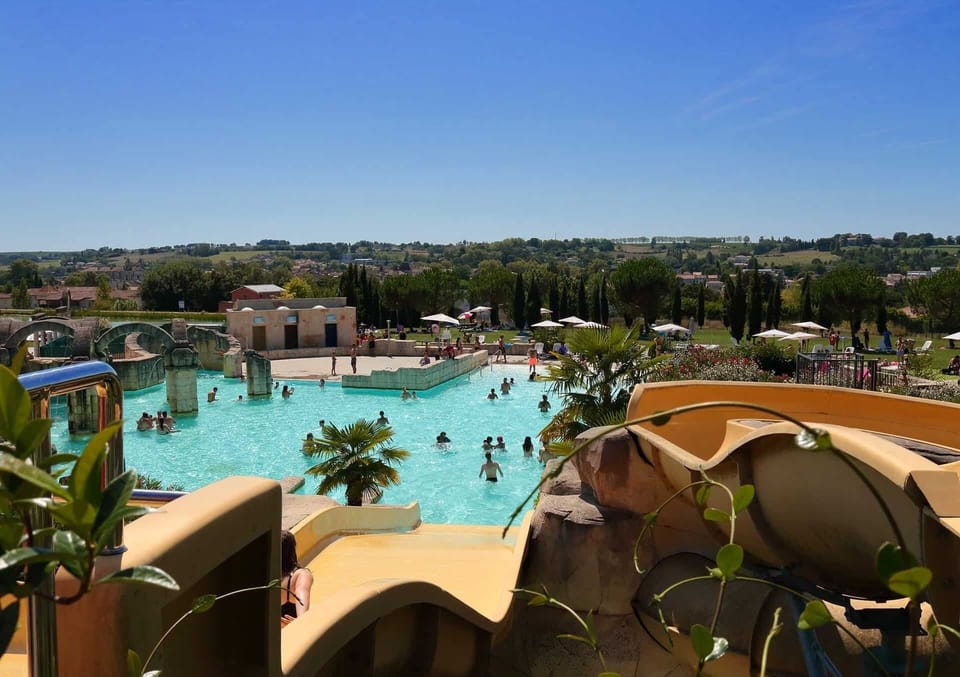 Rushing down into cool water — the 1,000 m² water park sits right next to the residence.
