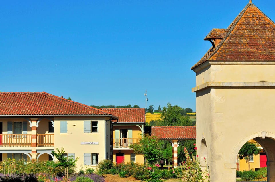 Half-timbered facades line Nérac's old streets — the medieval town centre is a 5-minute walk.