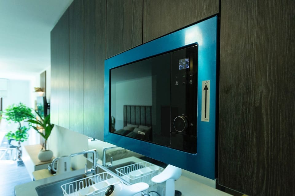 Deluxe Apartment, Balcony, Pool View | Microwave