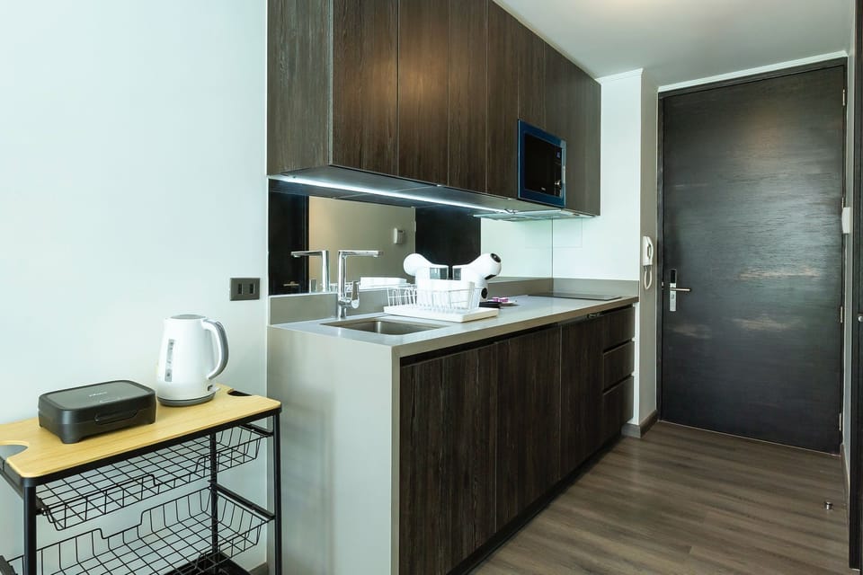 Deluxe Apartment, Balcony, Pool View | Private kitchen | Microwave, oven, cookware/dishes/utensils