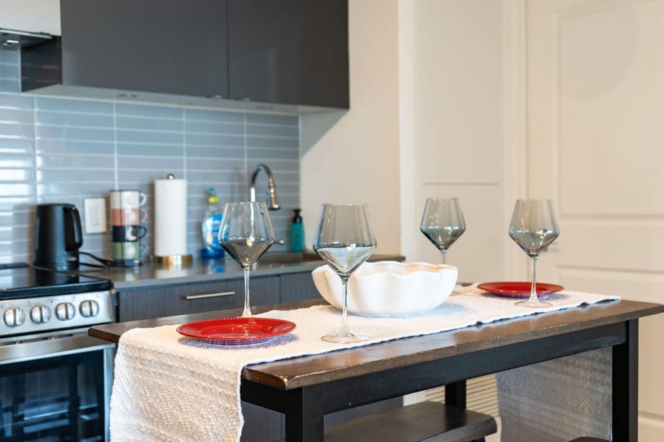Luxury Suite, 2 Bedrooms | Private kitchen | Full-size fridge, microwave, oven, stovetop