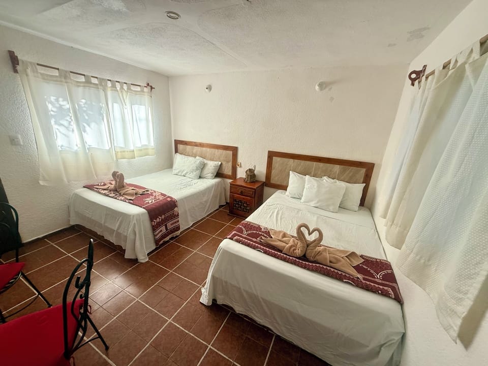 Deluxe Quadruple Room, Garden View | Desk, WiFi (free), bed sheets