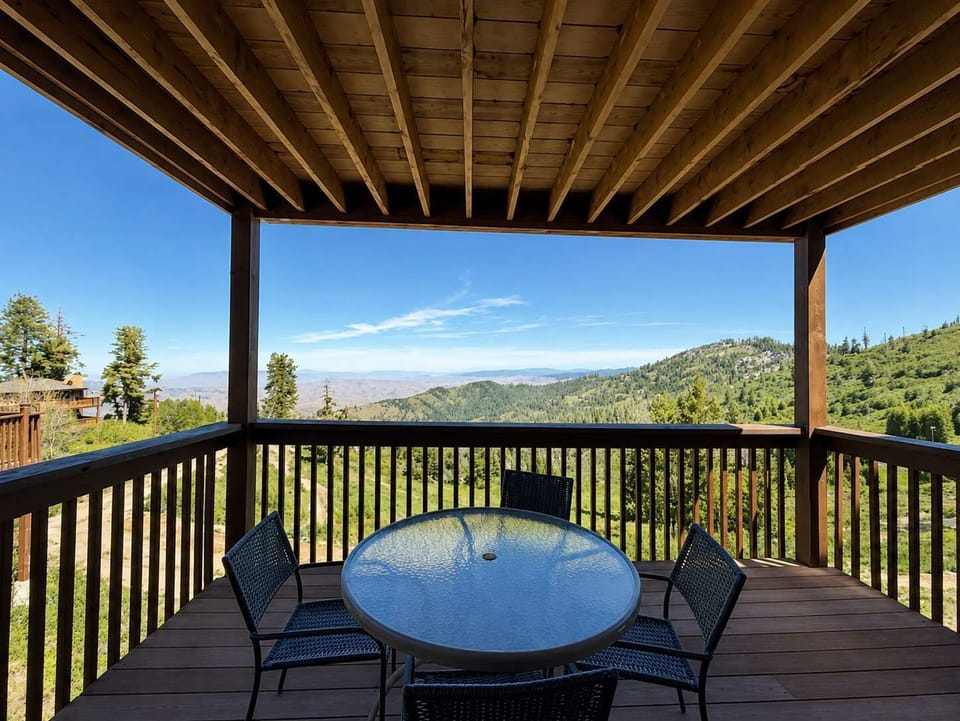 Covered balcony and view of mountains.
