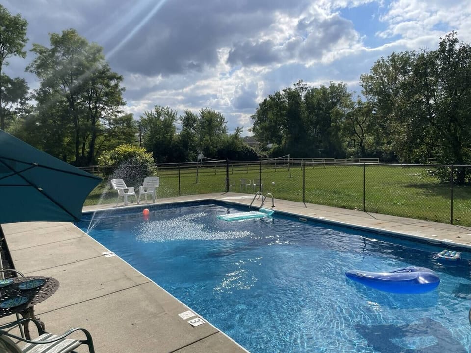 18x36 pool adjacent to picnic and BBQ area. 3 feet at shallow end, 8 feet at deep end. Clear view of other exterior activities. Easy access to guest bathroom without entering the main house. Life safety equipment hangs on the fence. Lockable fence.