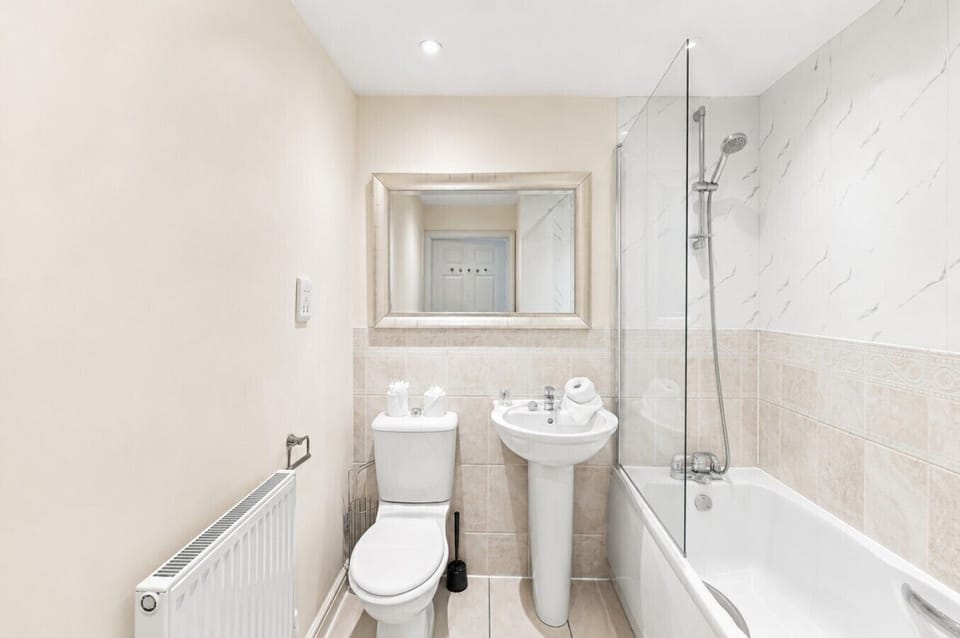 Bathroom with a shower over bath and complimentary toiletries provided.