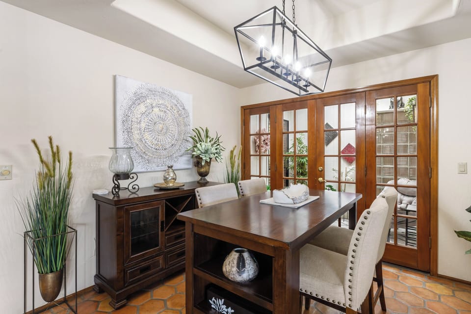 Dining Table and french doors leading to the atrium