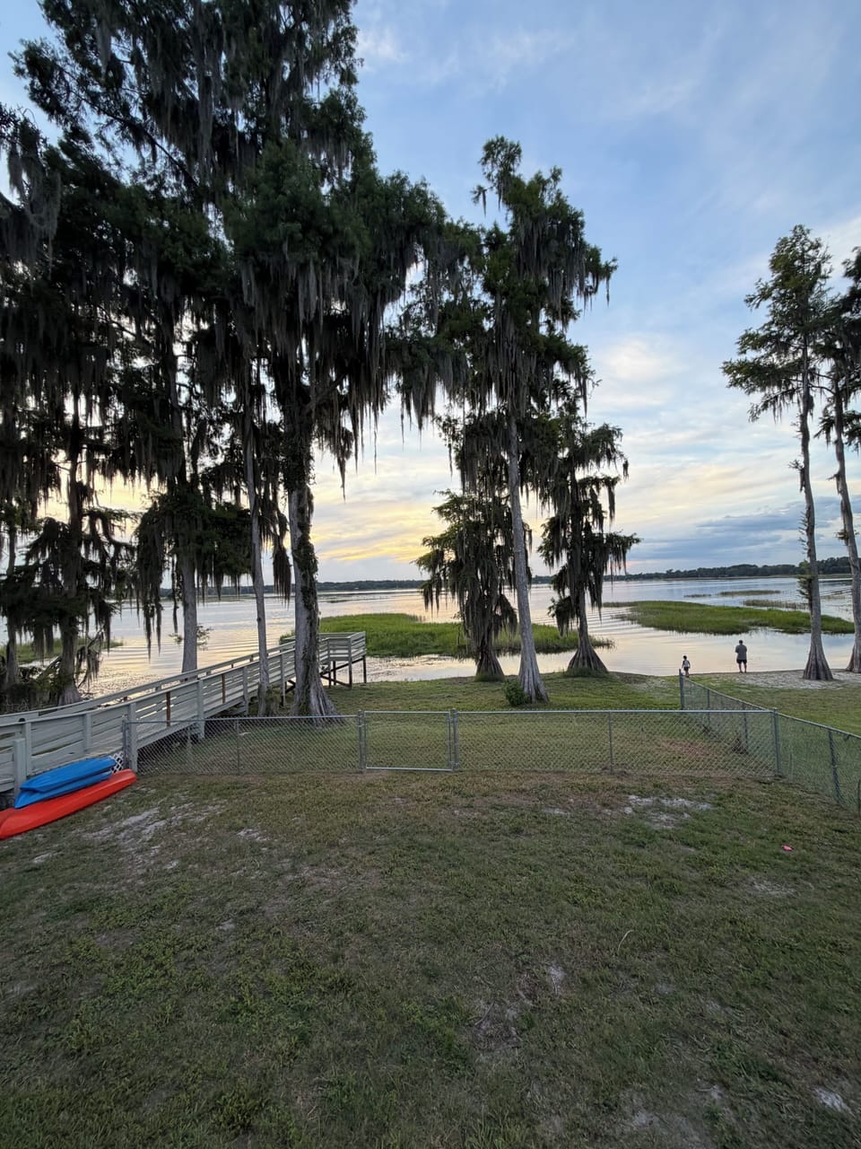 Enjoy safety of a fenced backyard with kayaks and paddleboards available
