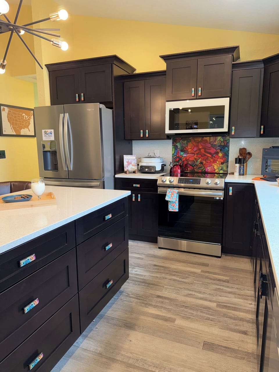 Enjoy meal prep with a lake view in this fully stocked gourmet kitchen