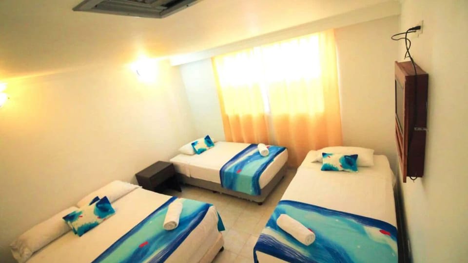 Standard Quadruple Room, Balcony, City View | In-room safe, iron/ironing board (on request), WiFi (free)