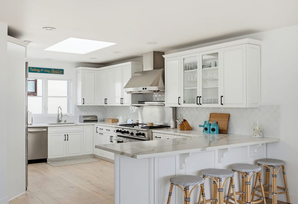 Spacious kitchen with oversized island seating, ideal for morning coffee, casual meals, and evening conversations.