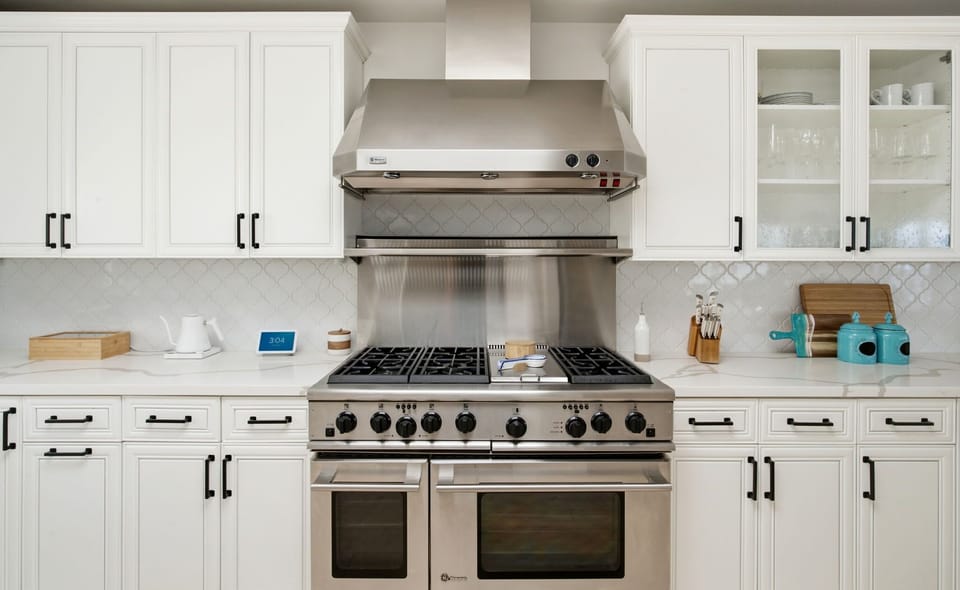 Premium appliances, generous counter space, and a bright coastal aesthetic.