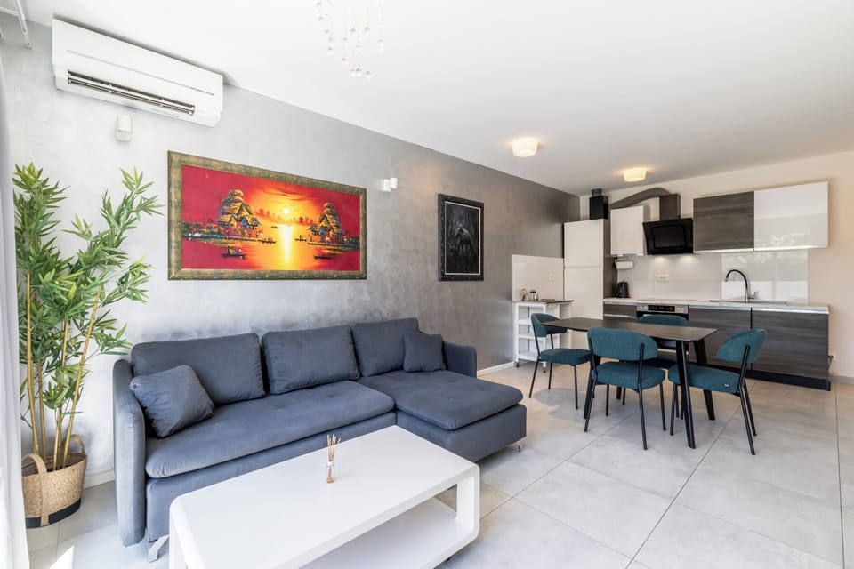 Classic Apartment, Patio, Garden View | Living area | Flat-screen TV