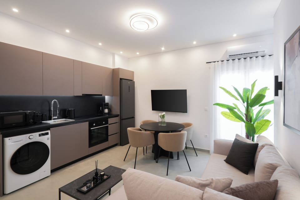 Comfort Apartment | Living area | 50-inch Smart TV with satellite channels