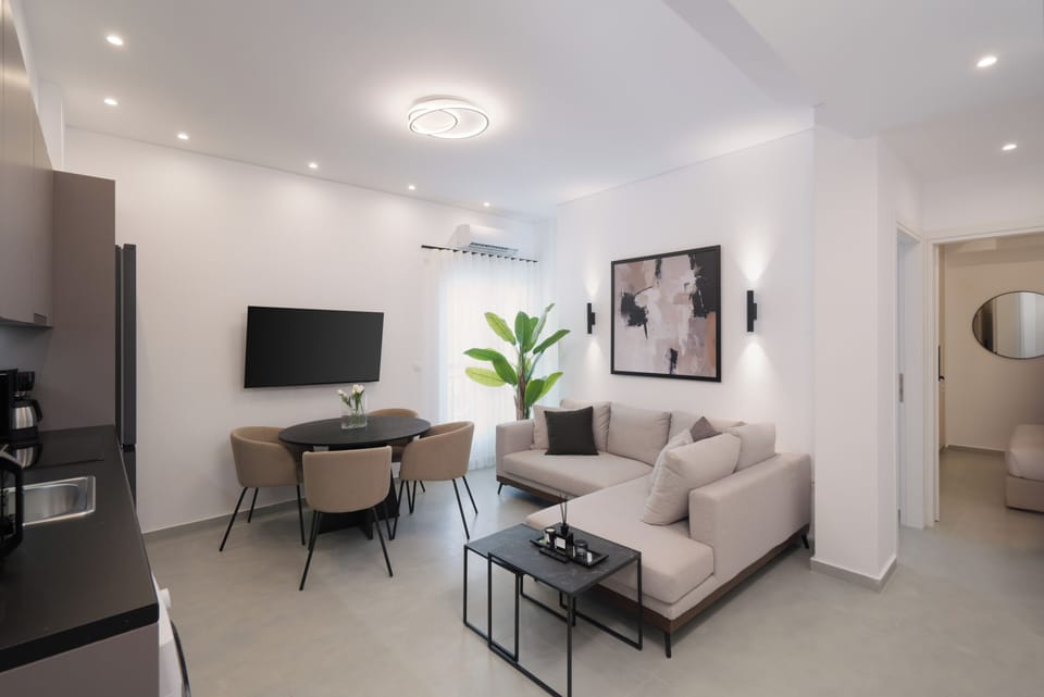 Comfort Apartment | Living area | 50-inch Smart TV with satellite channels