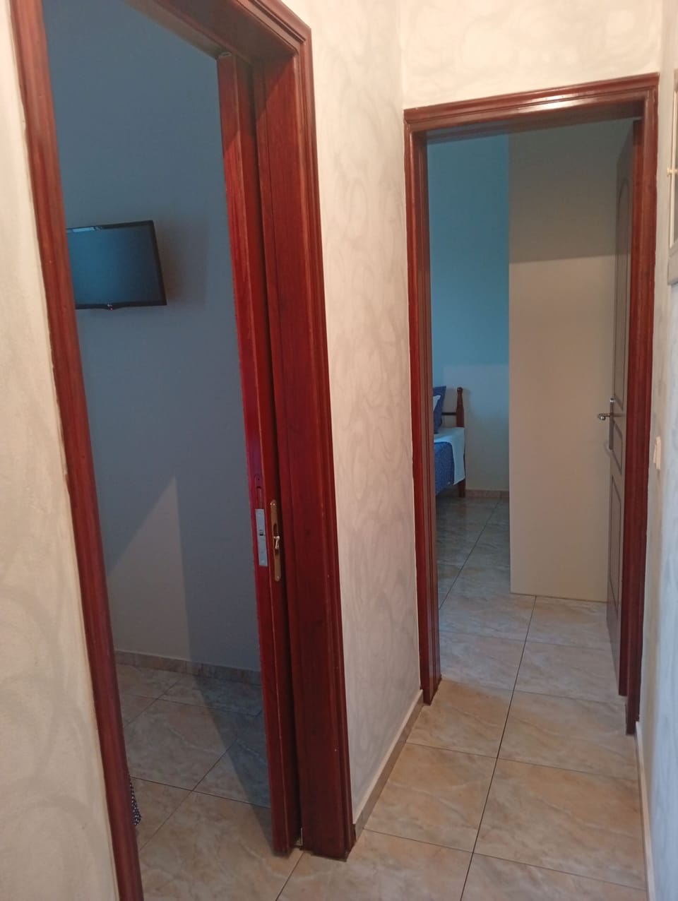Interior hallway connecting the main living spaces and bedrooms