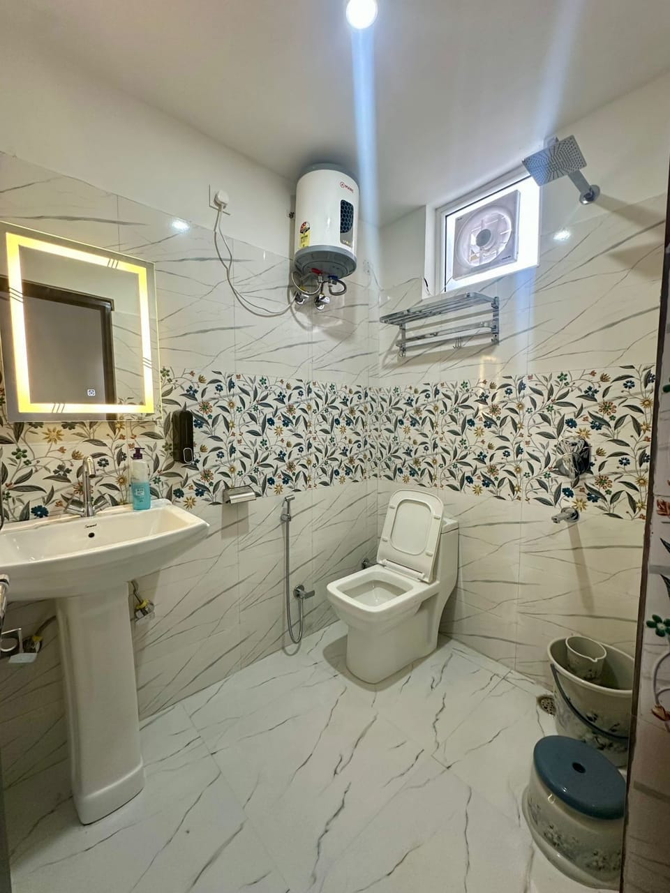 Shower, towels, soap, toilet paper