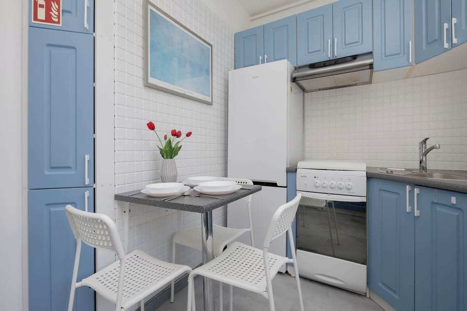 Functional kitchen with ample storage, worktop space, and modern appliances.