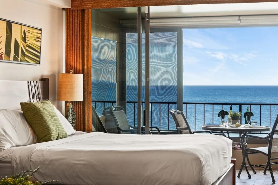 Wake up to endless ocean views from your bed