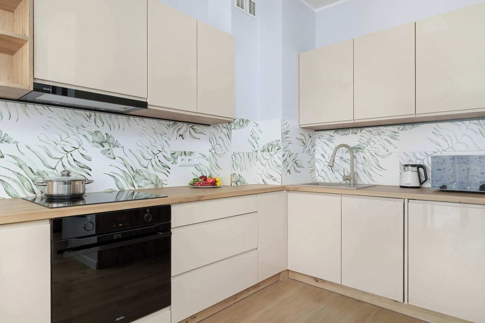 The sleek design of the kitchenette blending seamlessly with the living area.
