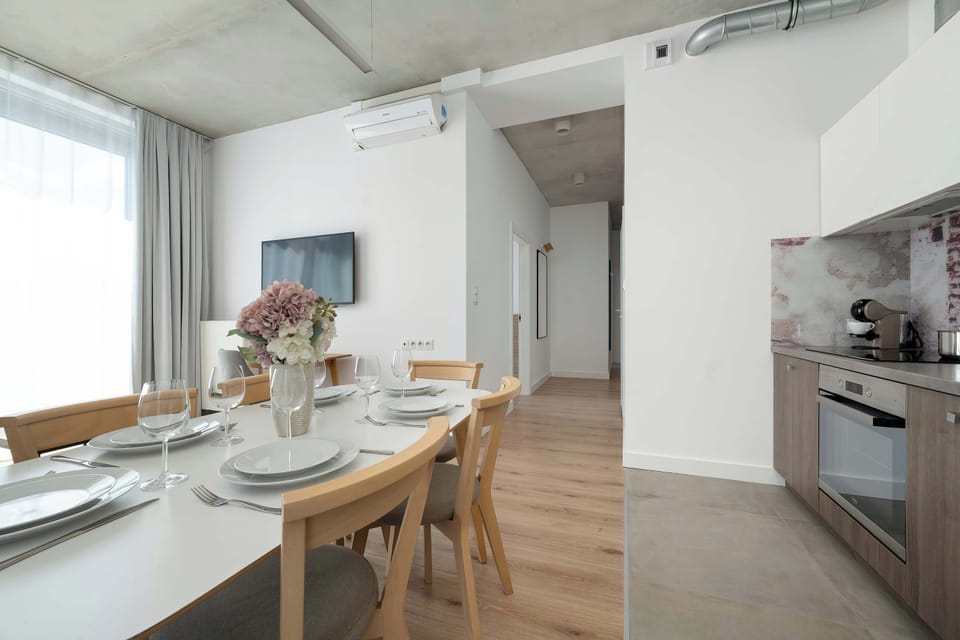 The living room has a modern look and comfortable furniture.