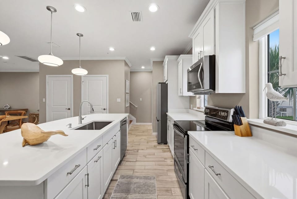 Turtles Nest- Prepare your favorite meals in this bright, fully equipped kitchen with modern appliances, ample counter space, and stylish finishes. Enjoy the comfort and convenience of a home away from home.
