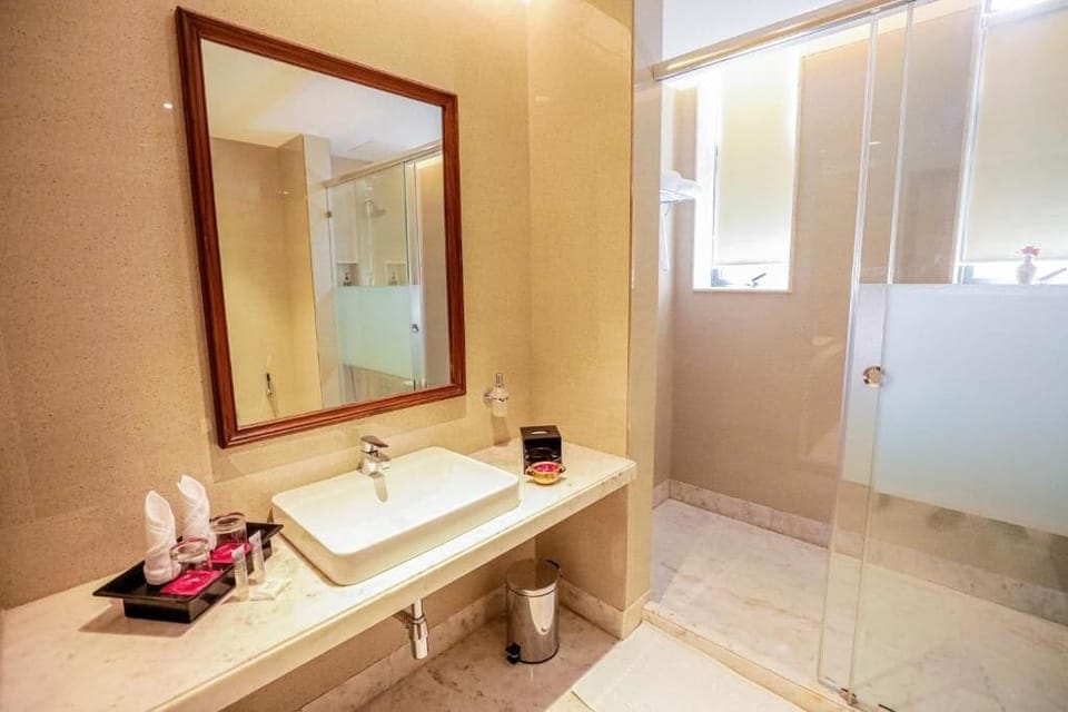 Shower, free toiletries, slippers, soap