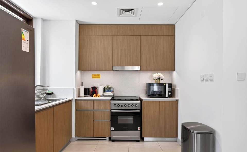 Family Apartment, Pool View | Private kitchen | Full-size fridge, microwave, oven, stovetop